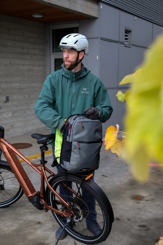 Man bike commuting with Ebike and Two Wheel Gear Inverter Pannier Backpack