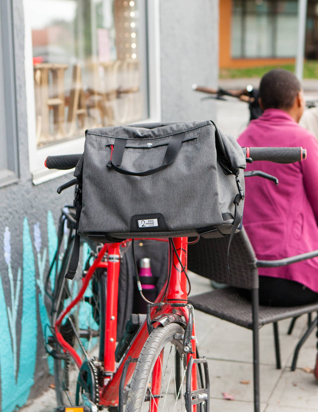 Two Wheel Gear Dayliner Handlebar & Trunk Bag on the front of a red bike.
