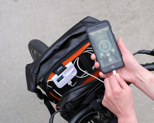 Phone with Joey app connected to the Joey SMART unit in the Alpha Handlebar bag.